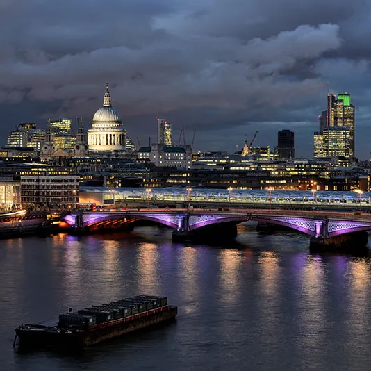 Evening photo of the river Thames with the St Paul's cathedral in the background