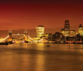 London tower bridge and the city at night with a red overlay